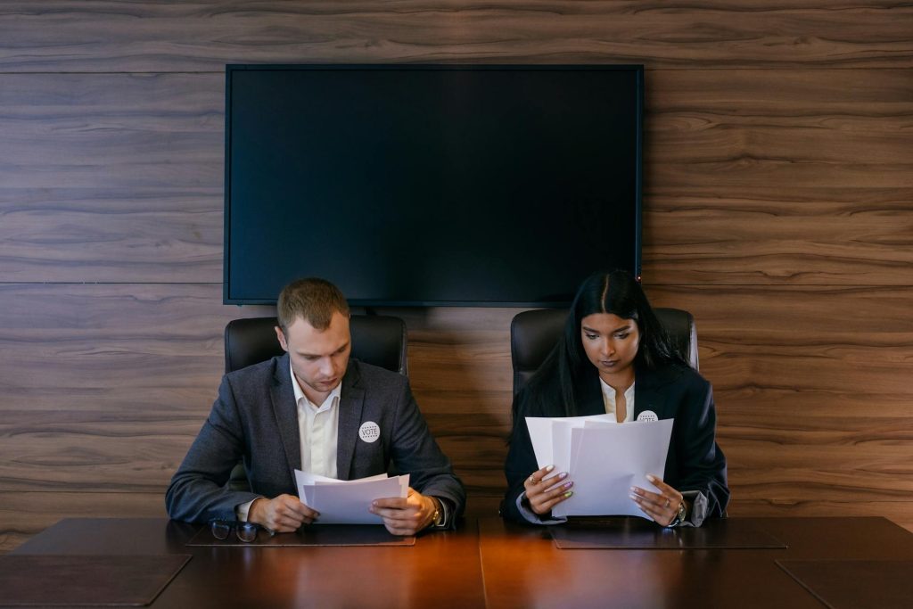Recruiter reviewing candidate resumes during screening process in Toronto office
