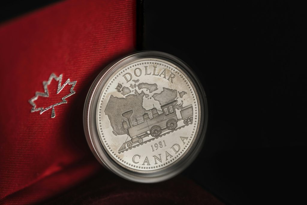 Canadian silver dollar coin symbolizing trust fund reconciliation in real estate